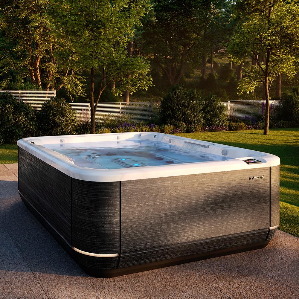 A Jacuzzi hot tub installed on a backyard patio